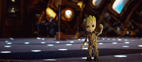 Small Groot Figurine From Guardians Of The Galaxy Standing In Room GIF