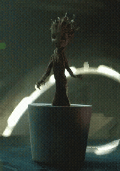 Small Groot Figurine In White Pot GIF