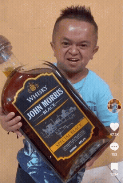 Small Man Holding John Morris Whisky GIF
