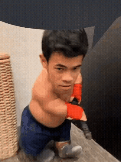 Small Man In Boxing Gloves And Shorts GIF