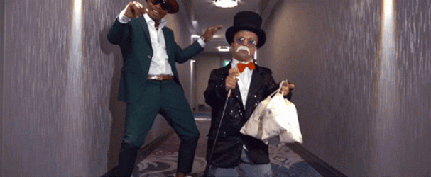 Small Mr Monopoly Holding Bags Of Money GIF