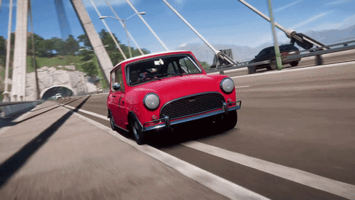 Small Red Car Driving On Bridge GIF