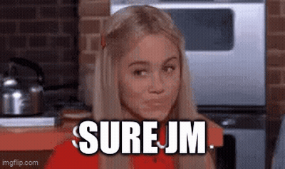 Small White Dog Sitting On Couch GIF