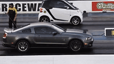 Smart Car And Mustang Racing GIF