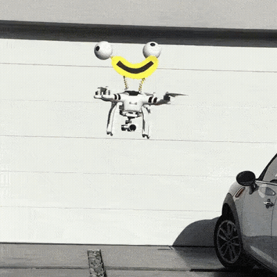 Smiley Drone Flying Over Parked Car GIF