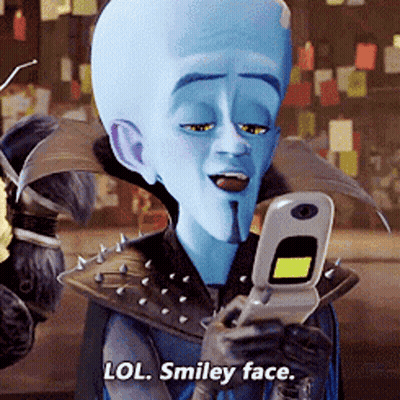 Smiley Face Saying Lol Holding Cell Phone GIF