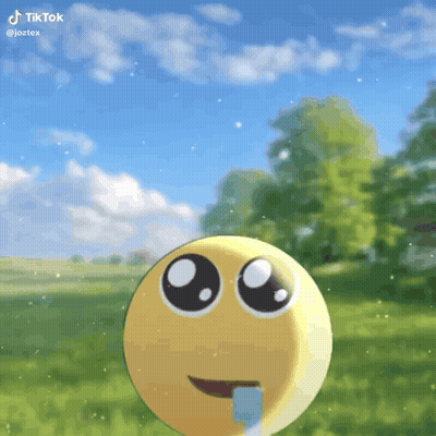 Smiley Face Sticking Tongue Out In Grass GIF
