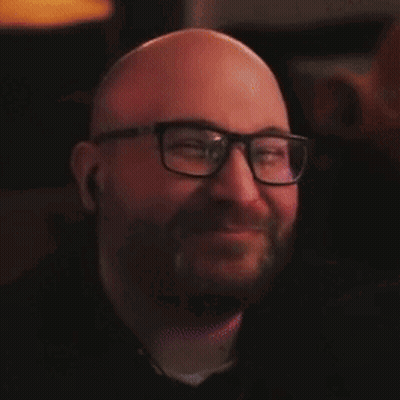 Smiling Bald Man With Beard And Glasses GIF