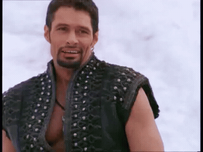 Smiling Bearded Man In Studded Black Vest GIF