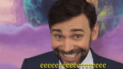Smiling Bearded Man On Purple Background Saying Eeeee GIF