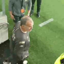 Smiling Bielsa Looks Up And Waves At Fans GIF