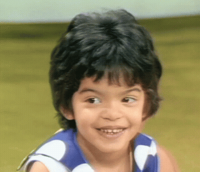 Smiling Boy In Blue White Polka Dot Shirt GIF