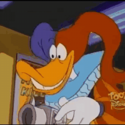 Smiling Cartoon Character Holding Camera At Disney Sign GIF