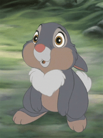 Smiling Cartoon Rabbit In Grass GIF