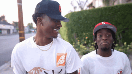 Smiling Duke Dennis Walking With Someone GIF