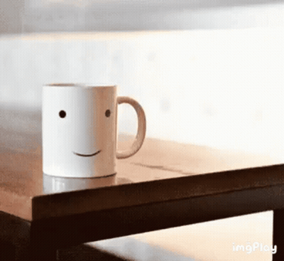 Smiling Face Coffee Mug GIF