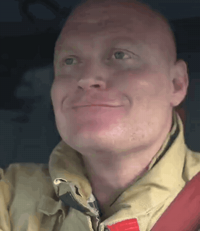 Smiling Fireman Looking Up GIF
