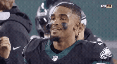 Smiling Football Player In Black Eagles Jersey GIF