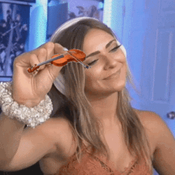 Smiling Girl Playing Smallest Violin GIF