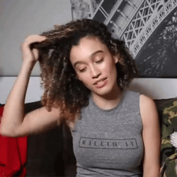 Smiling Girl Pull Hair Curly GIF
