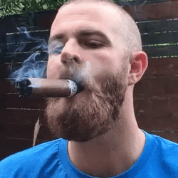 Smiling Guy While Smoking Cigar GIF