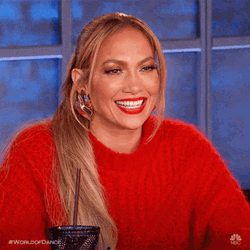 Smiling Jlo In Red Sweater GIF