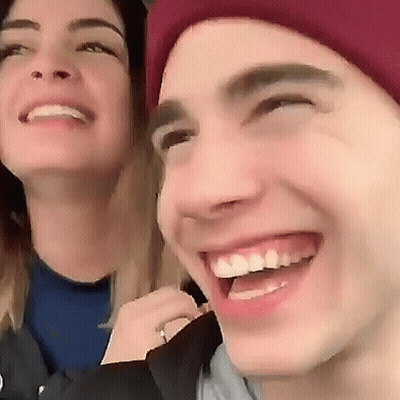 Smiling Man And Woman With Red Hat GIF