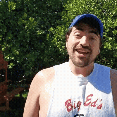 Smiling Man In Big Ed's Shirt Blue Hat GIF