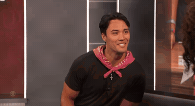 Smiling Man In Black Shirt And Pink Bandana GIF
