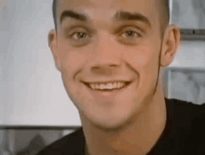 Smiling Man In Black Shirt GIF