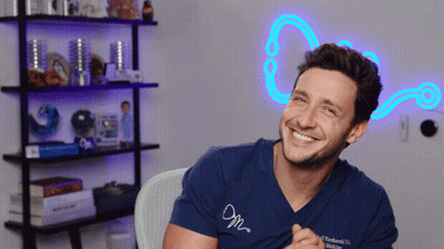 Smiling Man In Blue Shirt Saying M GIF