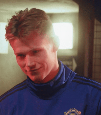 Smiling Man In Blue Shirt Saying Manchester GIF