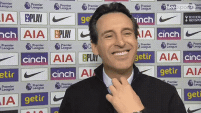 Smiling Man In Front Of AIA Cinch Ads GIF