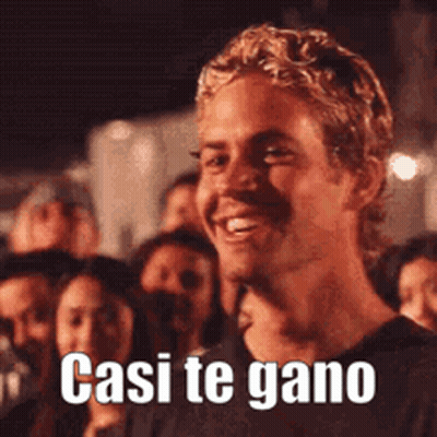 Smiling Man In Front Of Crowd Casi Te Gano GIF