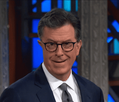 Smiling Man In Glasses And Suit GIF