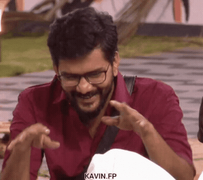 Smiling Man In Red Shirt And Glasses Pointing GIF
