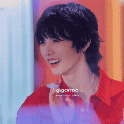 Smiling Man In Red Shirt Saying Gigantic GIF