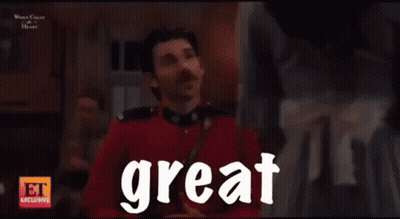 Smiling Man In Suit Saying Great To Woman GIF