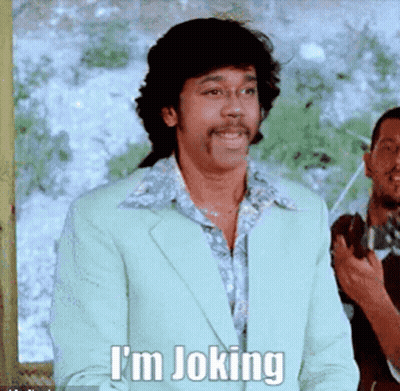 Smiling Man In Suit Says I'm Joking GIF