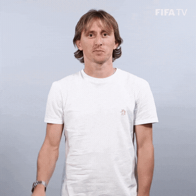Smiling Man In White T-Shirt Waving At FIFA TV Logo GIF