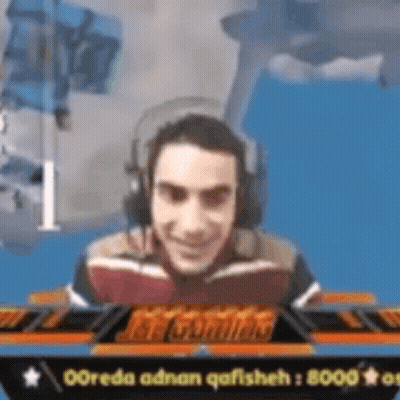 Smiling Man Playing Video Game With Headphones GIF