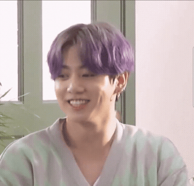 Smiling Man Purple Hair Green White Striped Shirt GIF