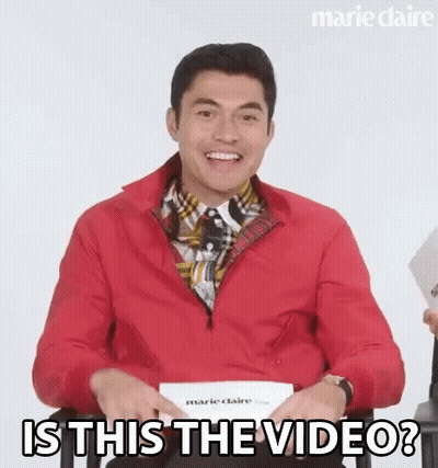 Smiling Man Red Jacket Asks Is This Video GIF