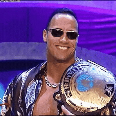 Smiling Man Wearing Sunglasses And Championship Belt GIF