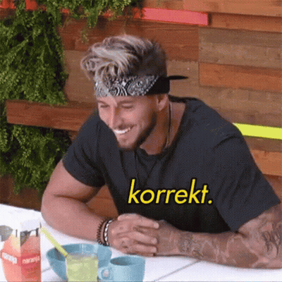 Smiling Man With Bandana And Korrekt Shirt GIF
