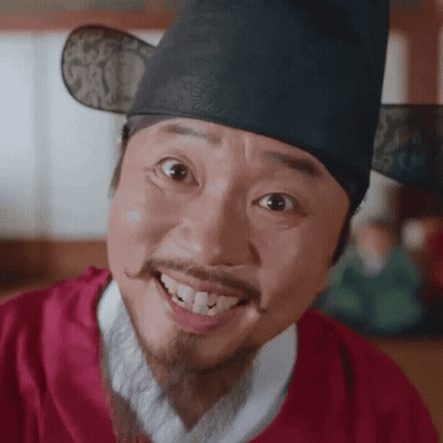 Smiling Man With Beard And Mustache In Red Shirt And Hat GIF