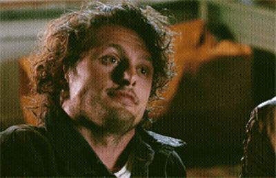 Smiling Man With Curly Hair And Beard GIF