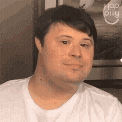 Smiling Man With Down Syndrome In White Shirt GIF
