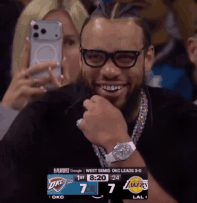 Smiling Man With Glasses And OKC Scoreboard GIF