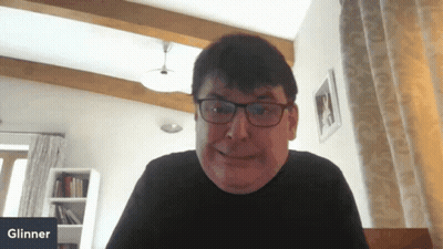 Smiling Man With Glasses At Glinner Sign GIF